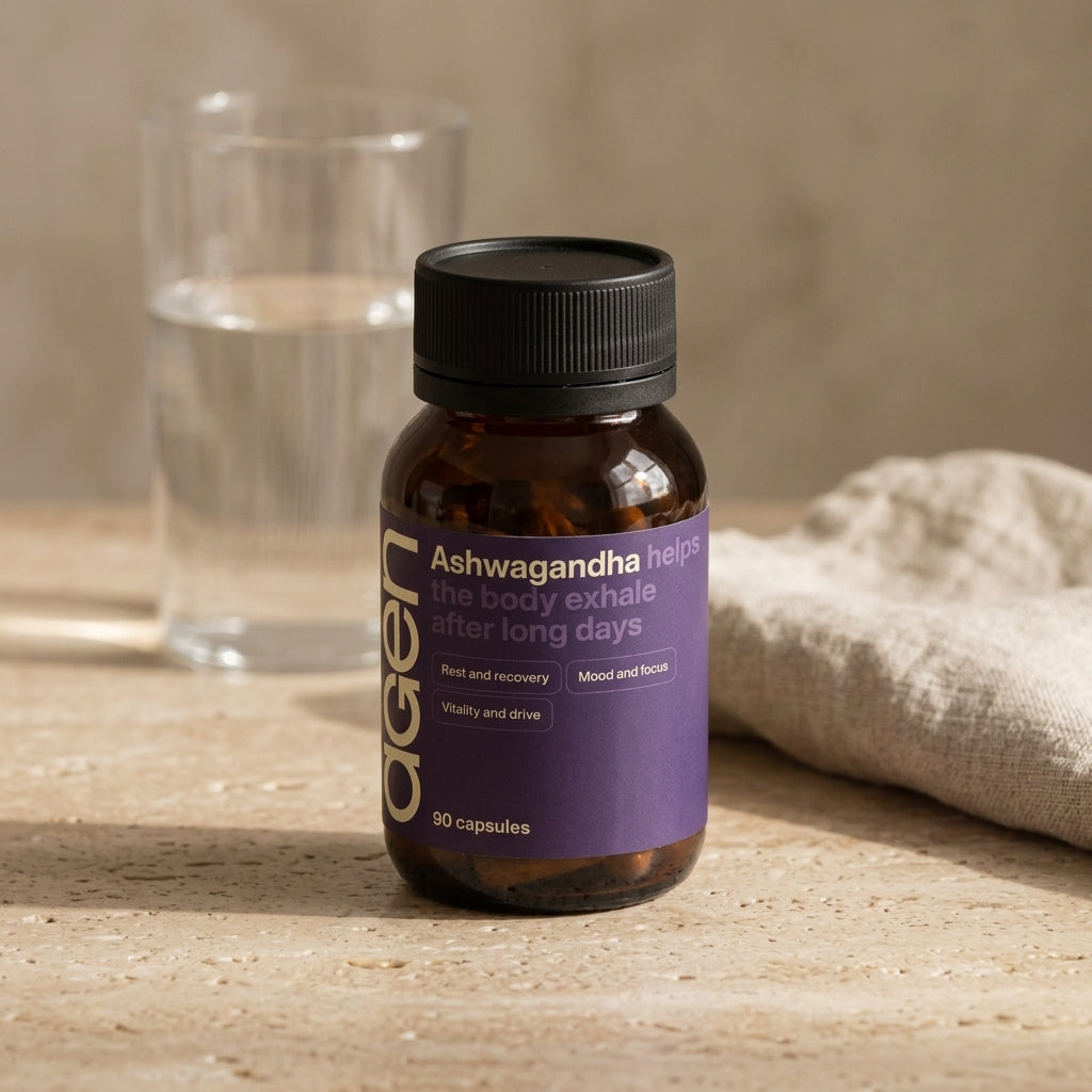Agen Ashwagandha bottle on a travertine counter in soft morning light