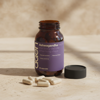Agen Ashwagandha — open bottle with capsules on a stone counter