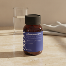 Agen Collagen Complex bottle on a travertine counter in soft morning light