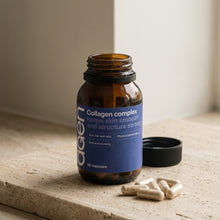 Agen Collagen Complex — open bottle with capsules on a stone counter