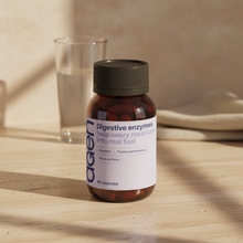 Agen Digestive Enzymes bottle on a travertine counter in soft morning light