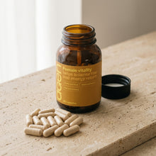 Agen Female Vitality — open bottle with capsules on a stone counter