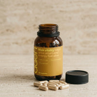 Agen Male Vitality — open bottle with capsules on a stone counter