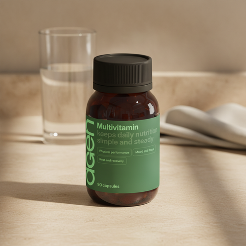 Agen Multivitamin bottle on a travertine counter in soft morning light