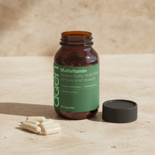 Agen Multivitamin — open bottle with capsules on a stone counter