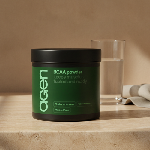 Agen BCAA Powder tub on a travertine counter in soft morning light