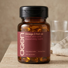 Agen Omega 3 Fish Oil jar on a travertine counter in soft morning light