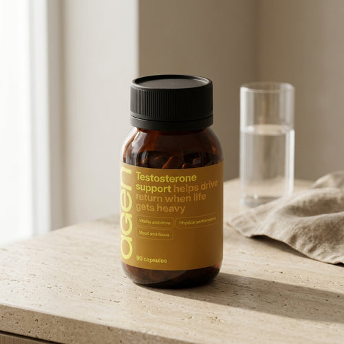 Agen Testosterone Support bottle on a travertine counter in soft morning light