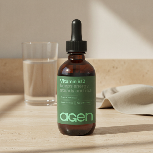 Agen Vitamin B-12 bottle on a travertine counter in soft morning light