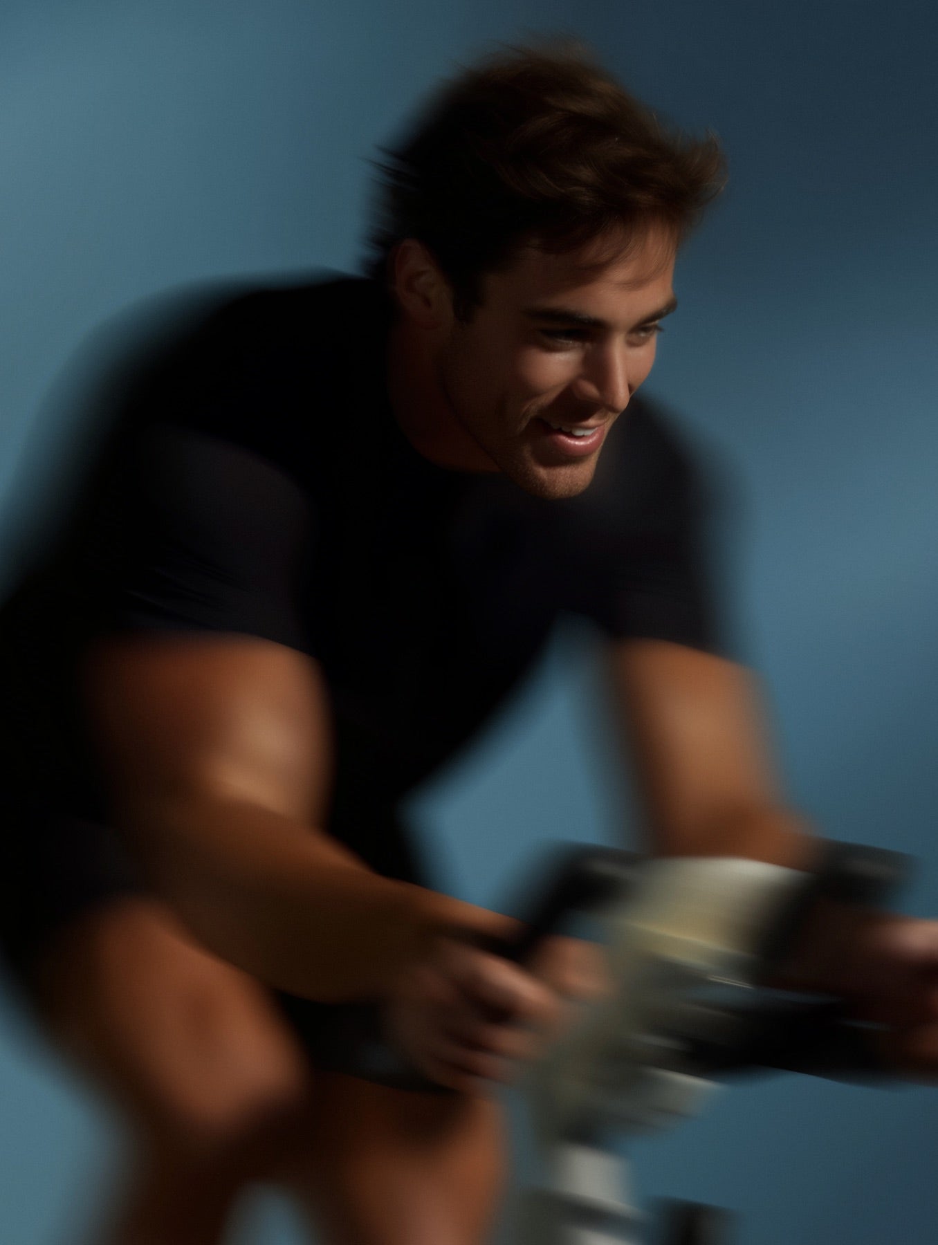 Early-morning indoor cycling session, motion-blurred